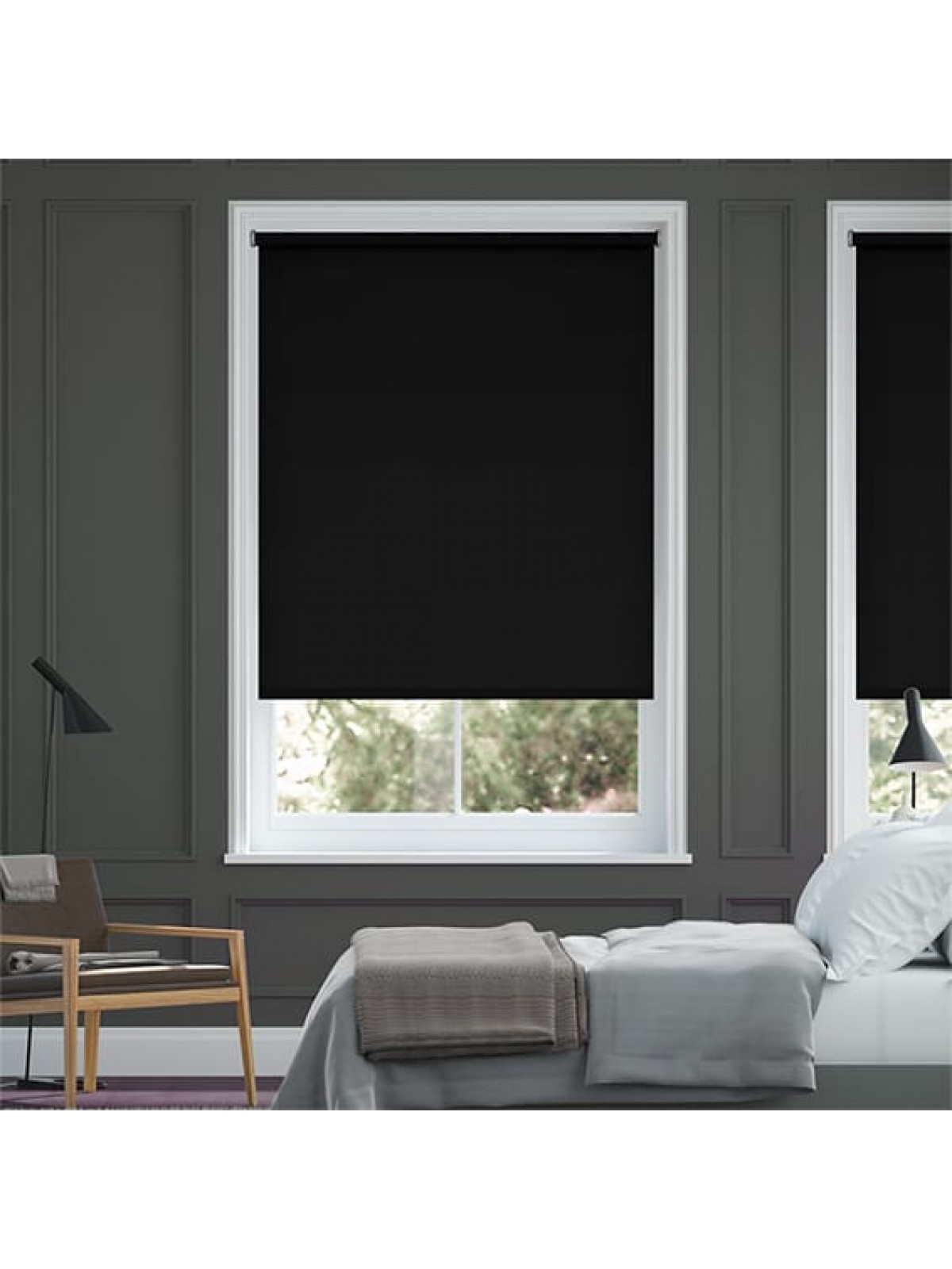 Woman pulling down fabric roller blinds in a modern Dubai living room